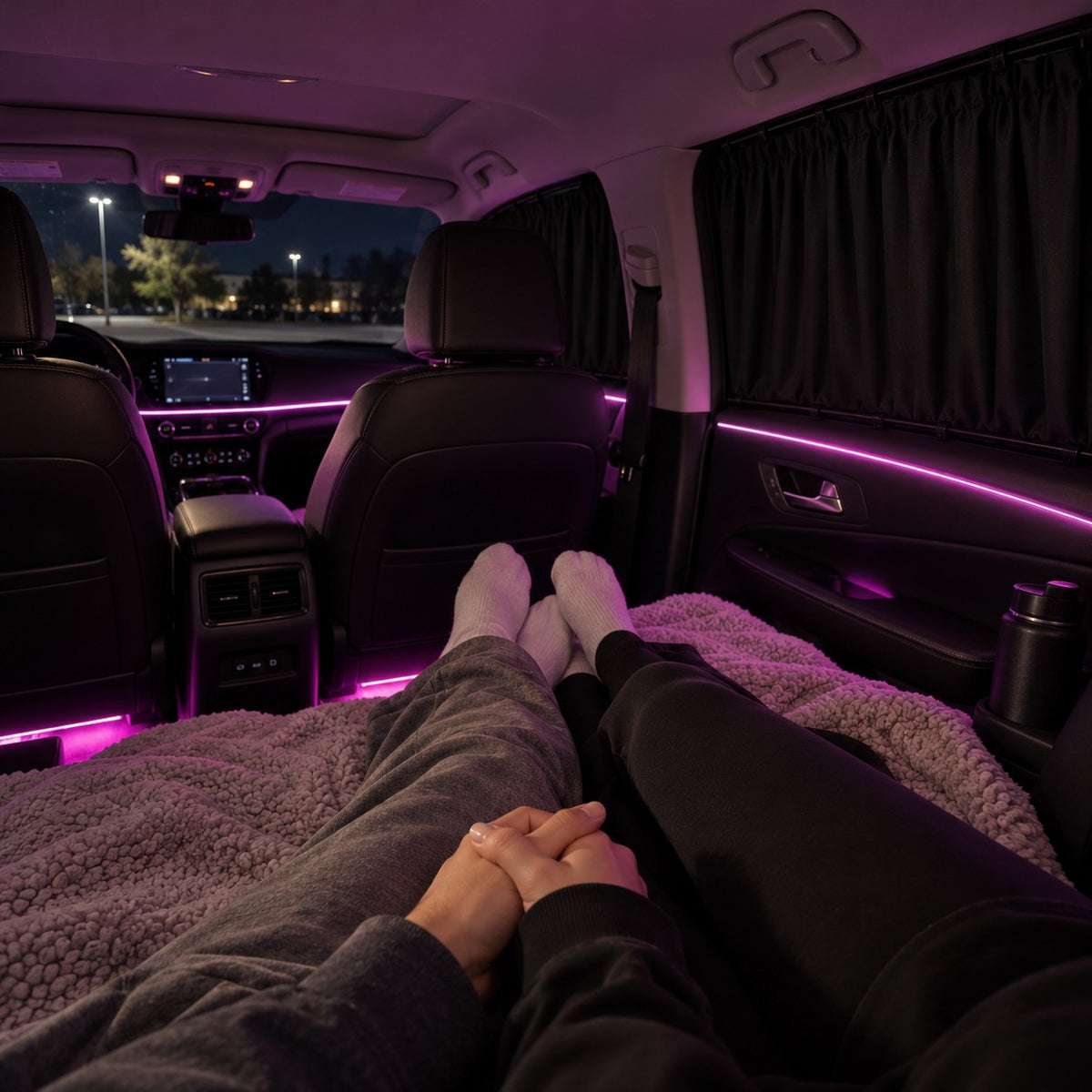A soft pink LED strip glowing inside a car at night