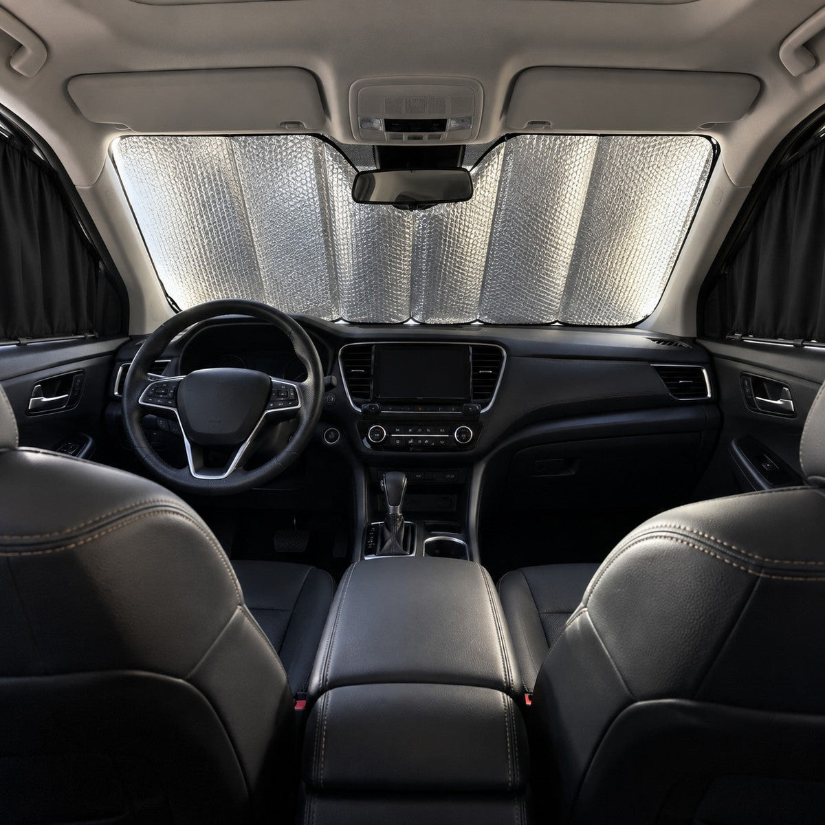 Reflective folding windshield sunshade fitted inside a parked car